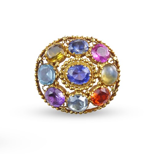 19th century nine stone vari-colour gem brooch, c.1830, of oval form, central sapphire to a surround including sapphire, ruby, catseye, hessonite garnet, aquamarine and amethyst,